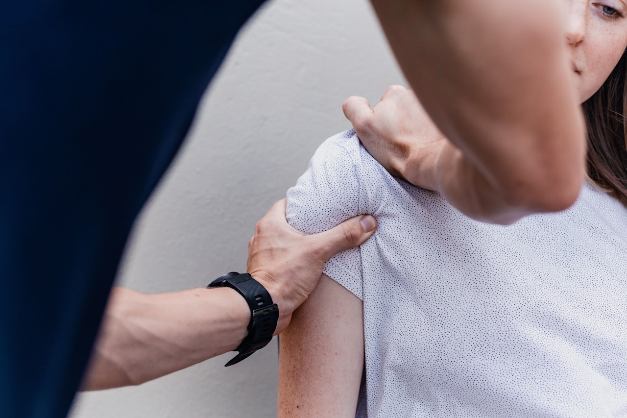 Physiotherapist assisting a patient representing medicinal cannabis for MS spasticity and rehabilitation in Australia