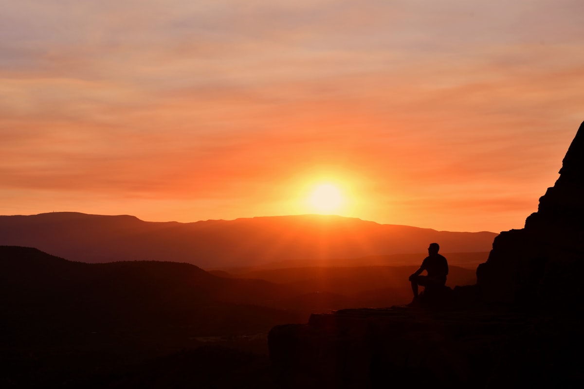Silhouette of a person at sunset representing the journey of Australian veterans seeking relief from PTSD and service-related conditions through medicinal cannabis