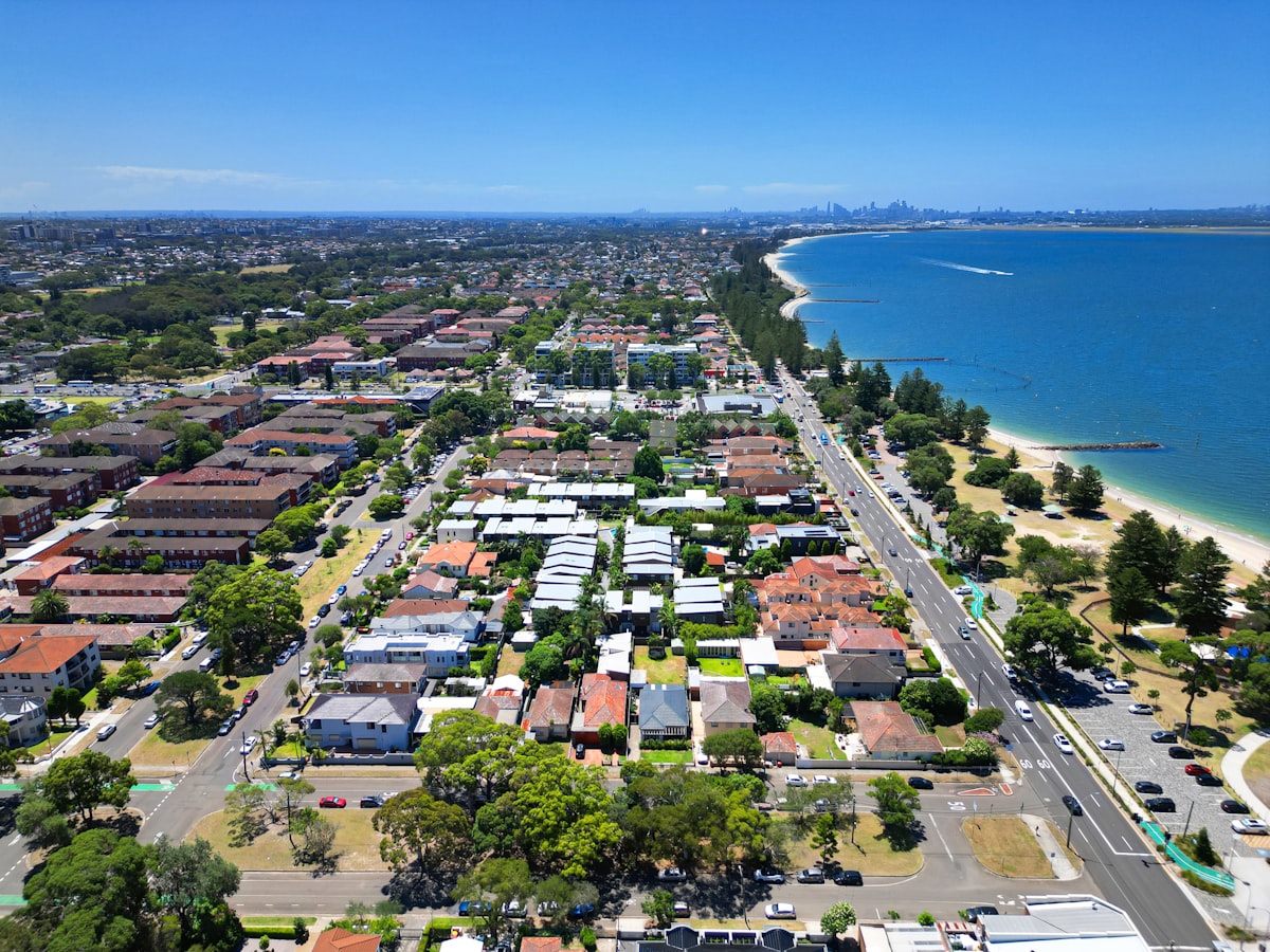 Aerial view of a coastal city by the ocean representing Darwin's unique position as Australia's tropical northern capital