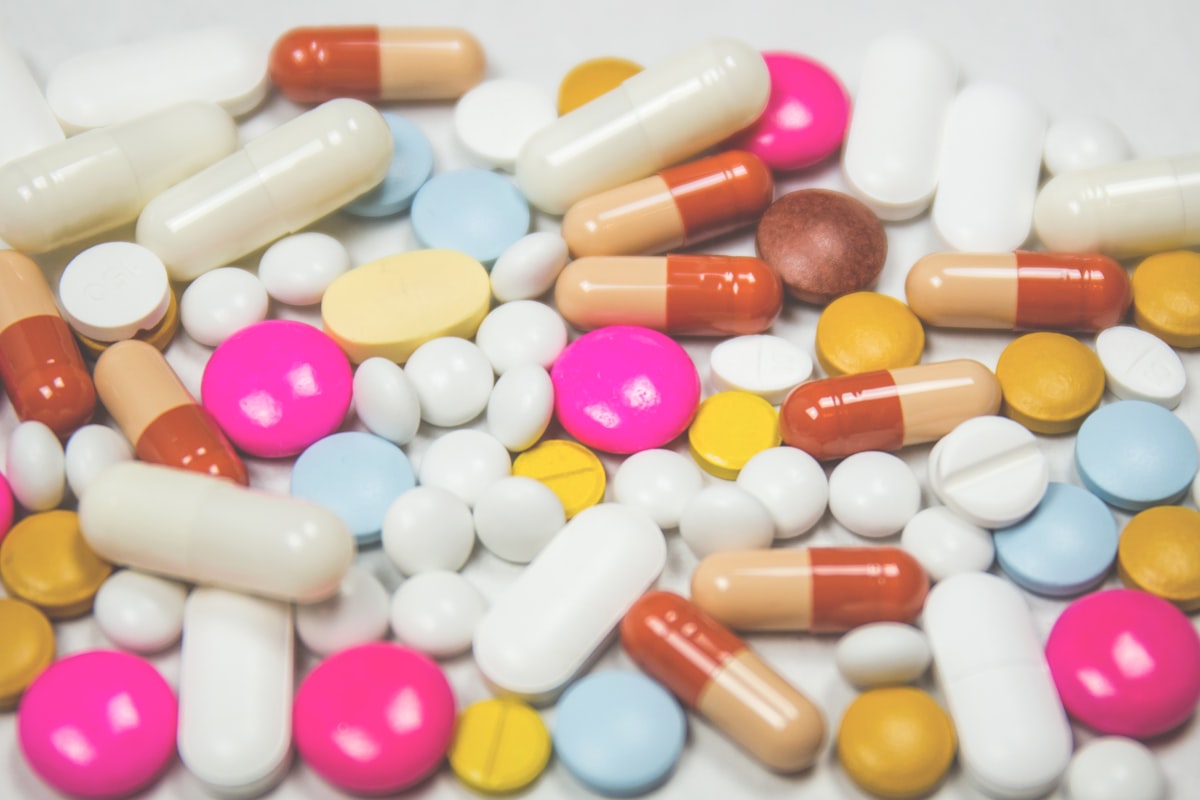 Assorted pharmaceutical capsules and medications representing the medicinal approach of Releaf Medical's cannabis prescribing service in Australia